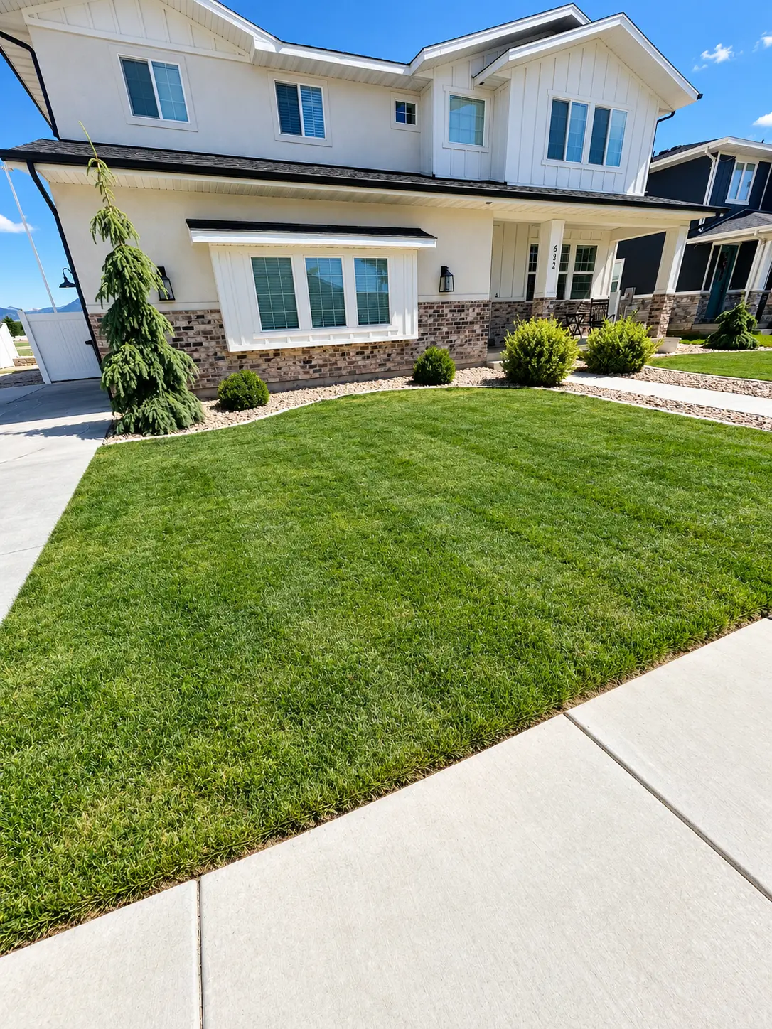 Finished front yard lawn beside a residential home